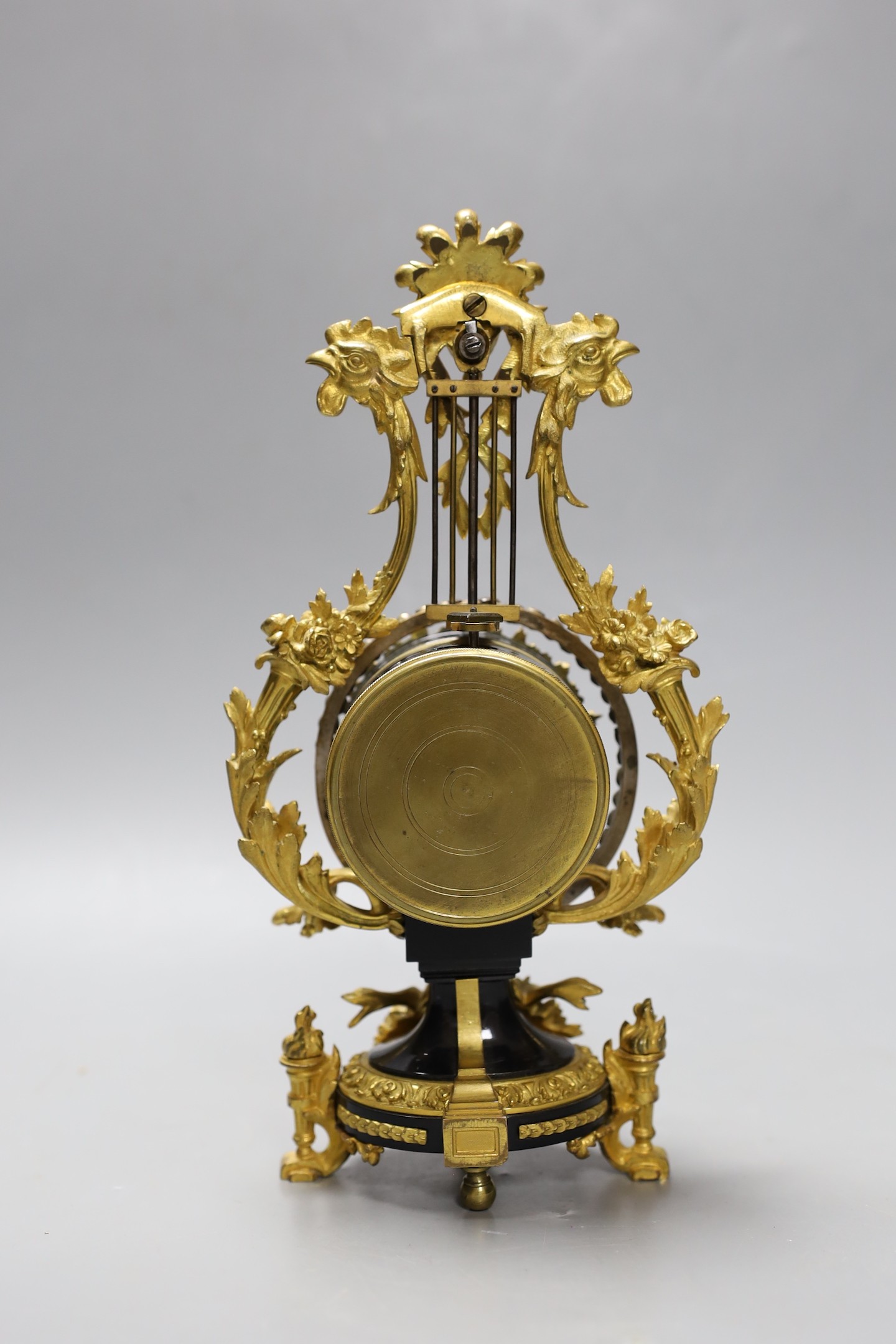 An early 20th century French ormolu mounted miniature lyre clock, 24 cm time